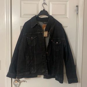 Black Levi’s jean jacket with tassels on the back